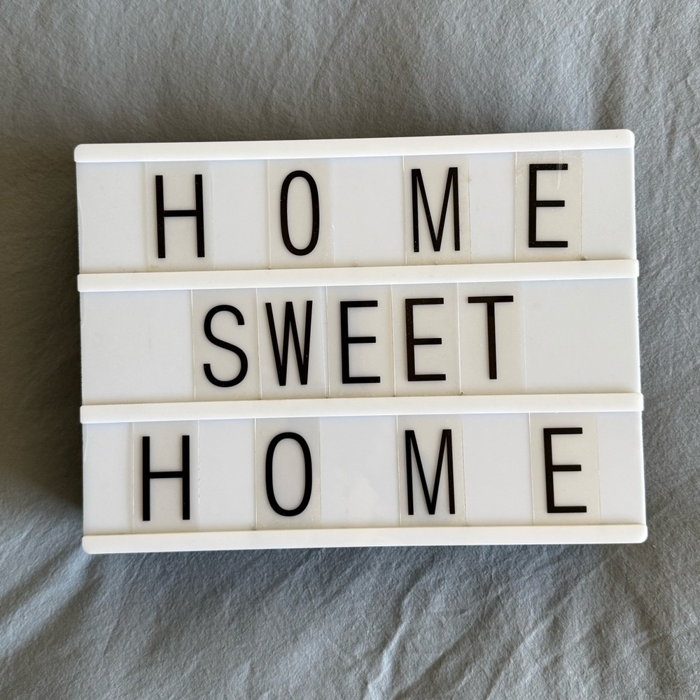 White cinema Lightbox Sign with Black Letters and symbols
